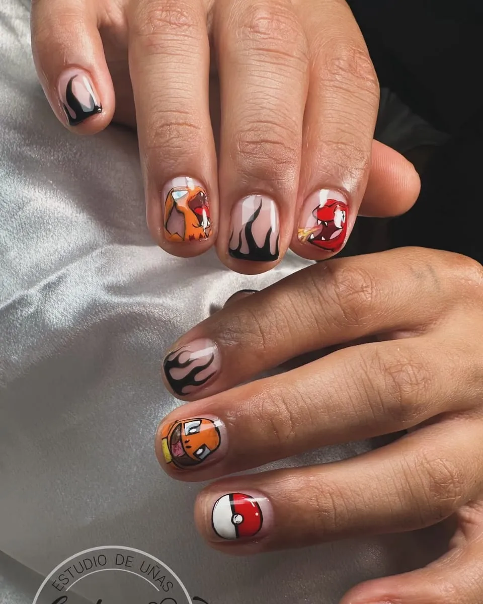 Short nails with hand-painted cartoon characters and flames