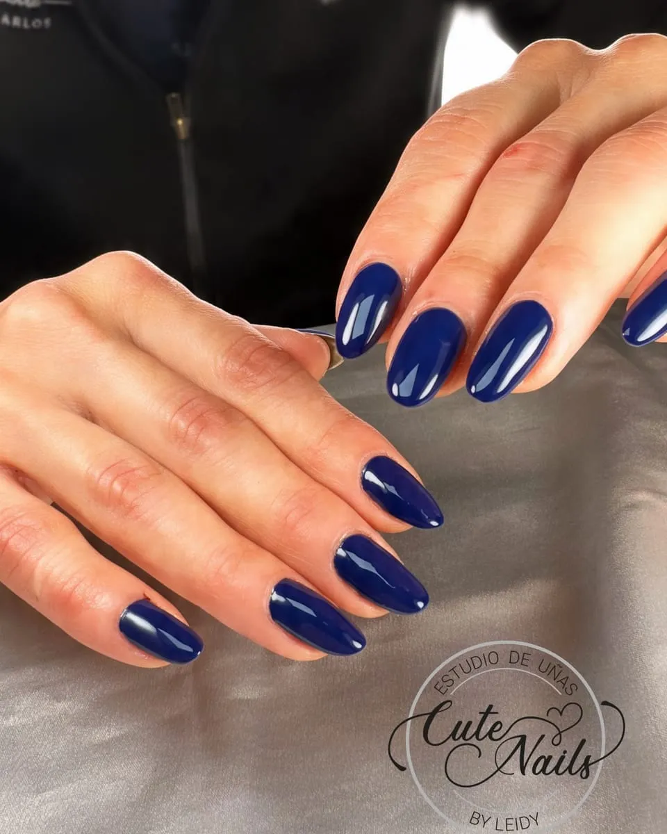 Glossy navy blue almond nails