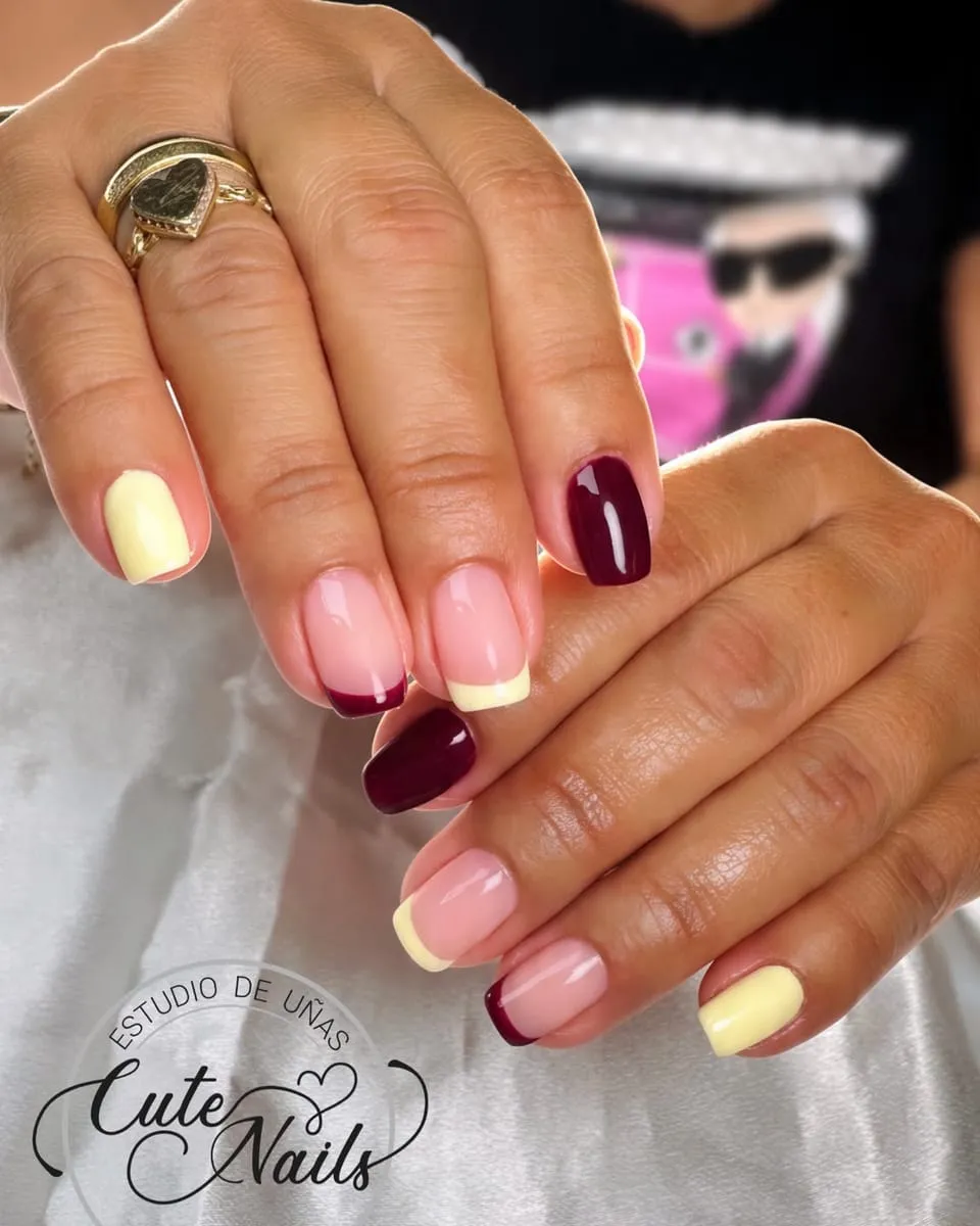 Mixed French tips in butter yellow and burgundy